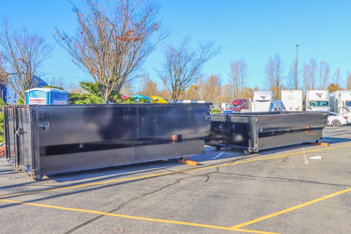 Professional dumpster rental service with roll-off container on residential driveway in The Village of Indian Hill